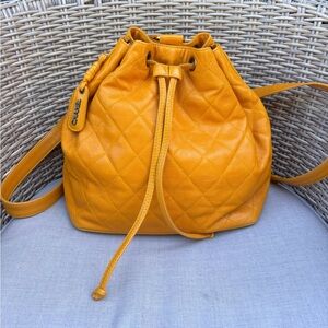 Authentic CHANEL Mustard caviar leather quilted drawstring backpack